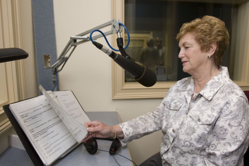Middle aged female volunteer recording for CRIS radio