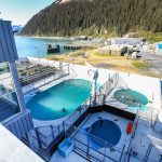 the sea life center's outdoor water system with several pools and is surrounding by snow capped mountains