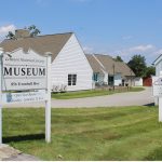 Lebanon Historical Society Museum “Exterior of the Lebanon Historical Society Museum in Lebanon, Connecticut. A large sign in front reads ‘Lebanon Historical Society Museum, 856 Trumbull Hwy,’ with white museum buildings and landscaped grounds in the background.”
